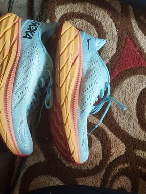 Hoka Women's Light Blue Running Shoes with Yellow Midsoles and Pink Accents